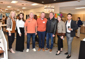 ReeceNichols agents pose for a photo during the Sep. 24, 2024, LGBT Chamber of Commerce Coffee Connections. From left to right, Amy Ringsdorf, Brecklyn Wright, Brian Partlow, David Slawson, John Price, Amy Loehr, and Fabián Gayosso.